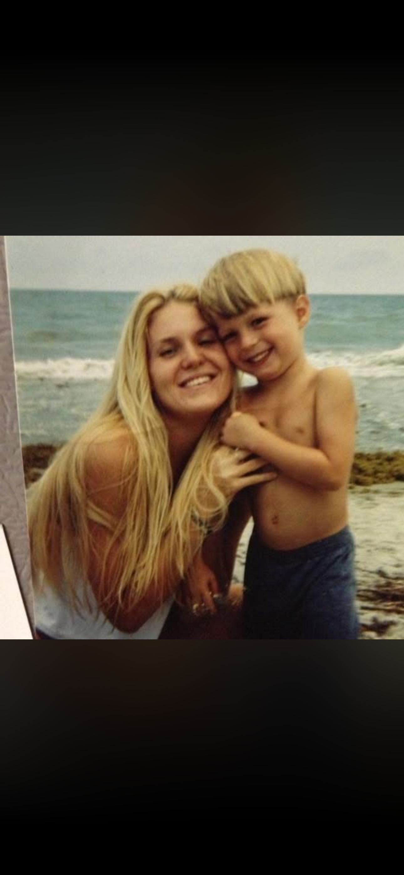 Young Stone at the beach with his mom