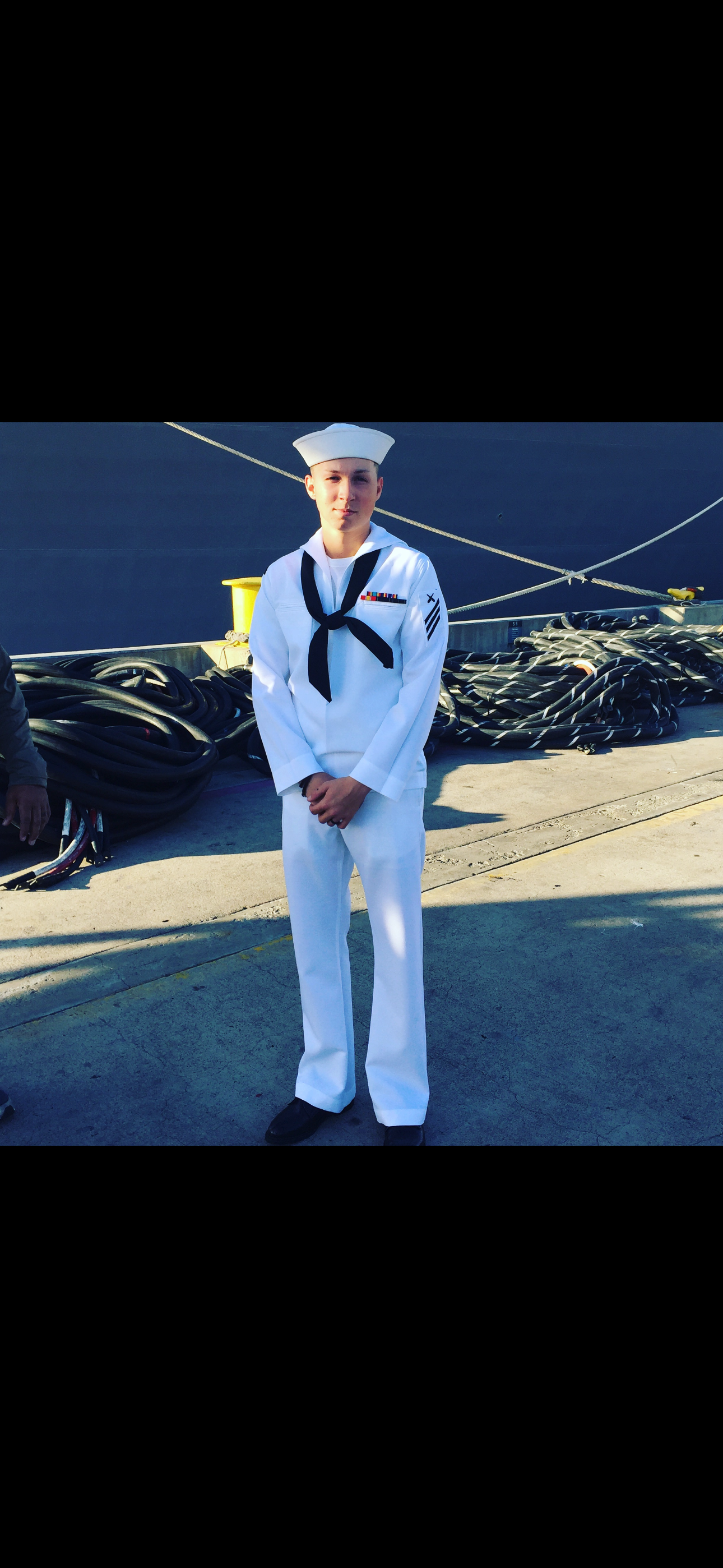 Stone in white Navy dress uniform at the dock