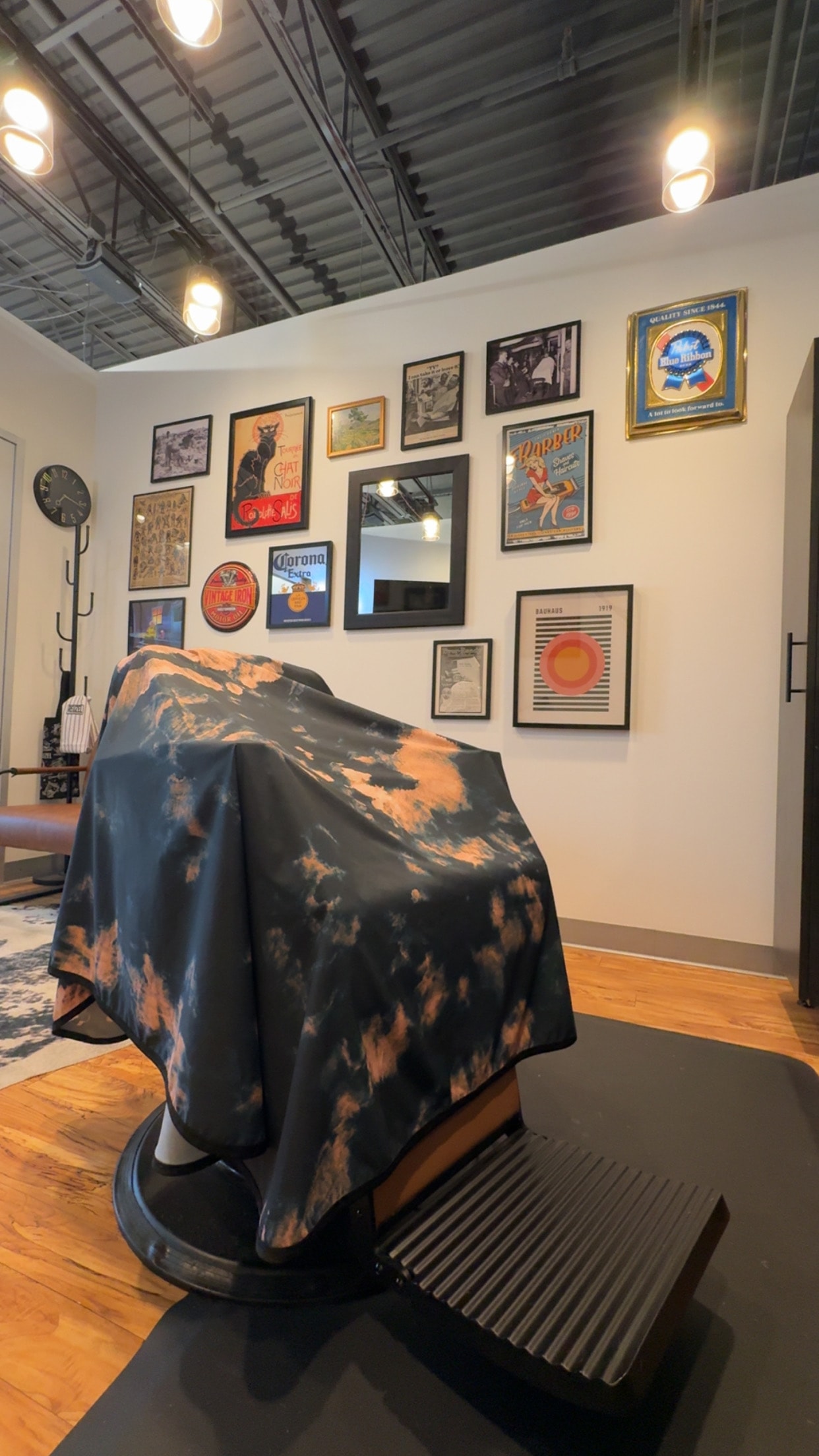 Barber cape draped over the chair at Pat's Parlor