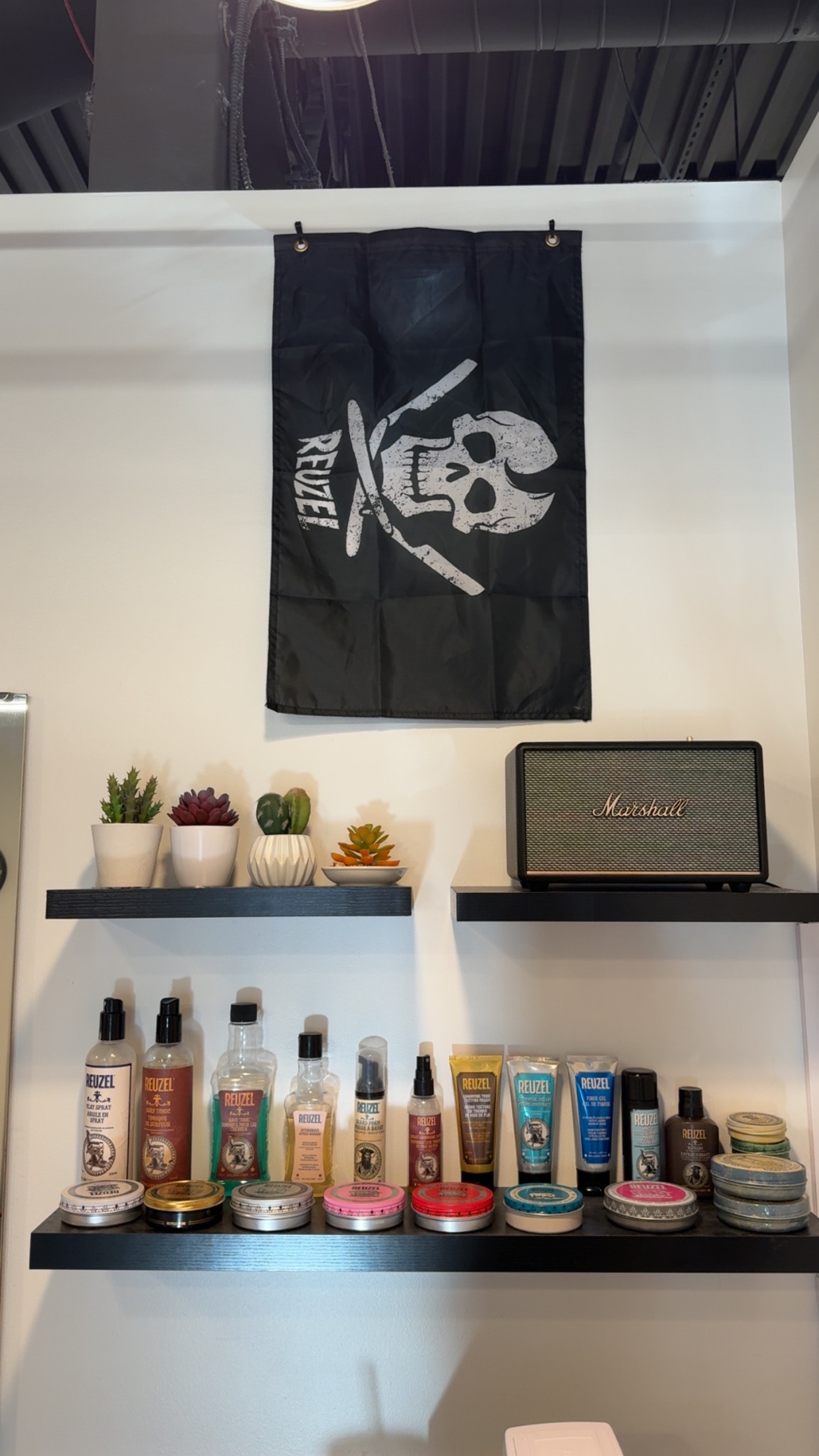 Reuzel products and shop shelf at Pat's Parlor