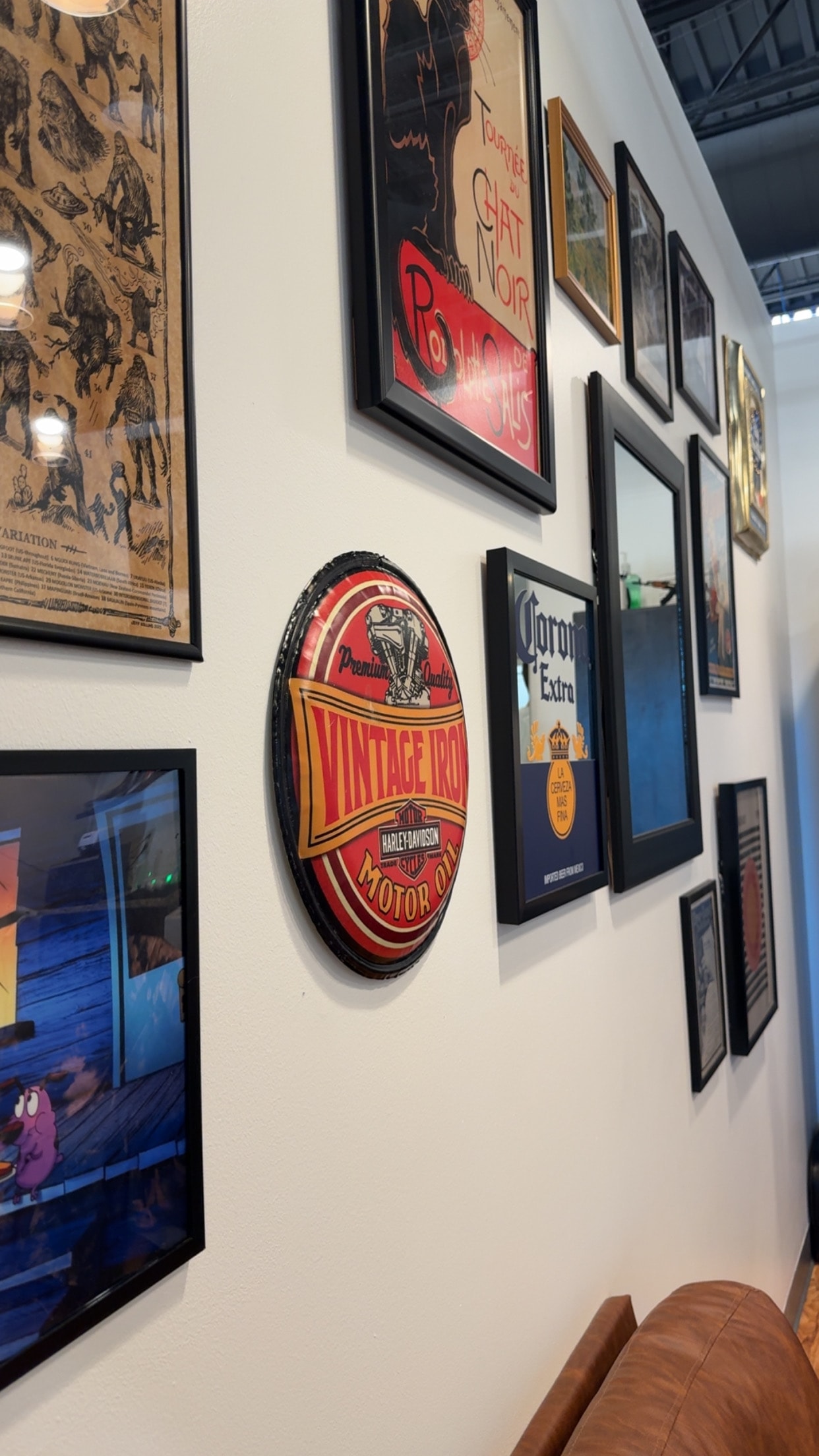 Vintage art wall at Pat's Parlor & Barber Co