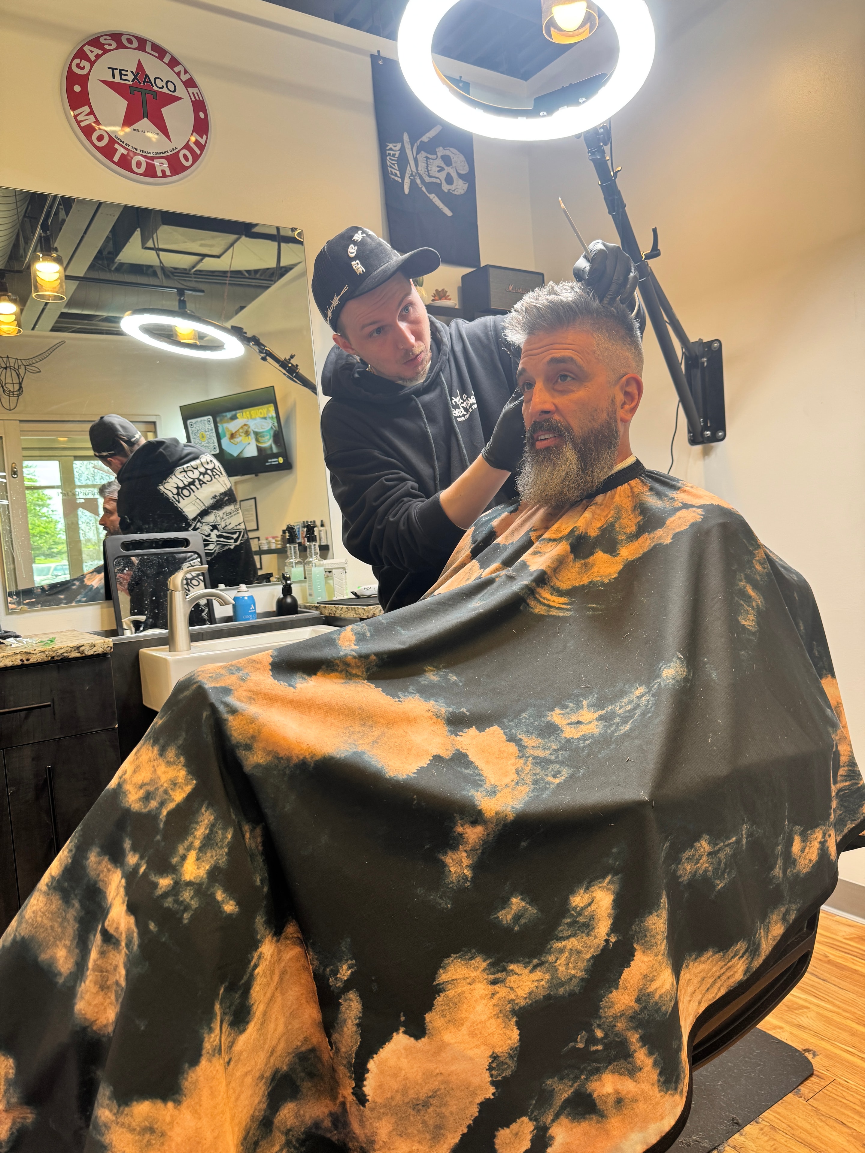 Stone working on a client at Pat's Parlor